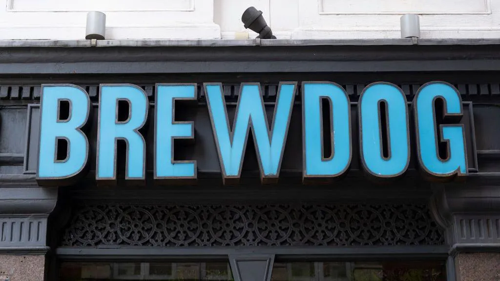 A blue sign which says Brewdog on a building.