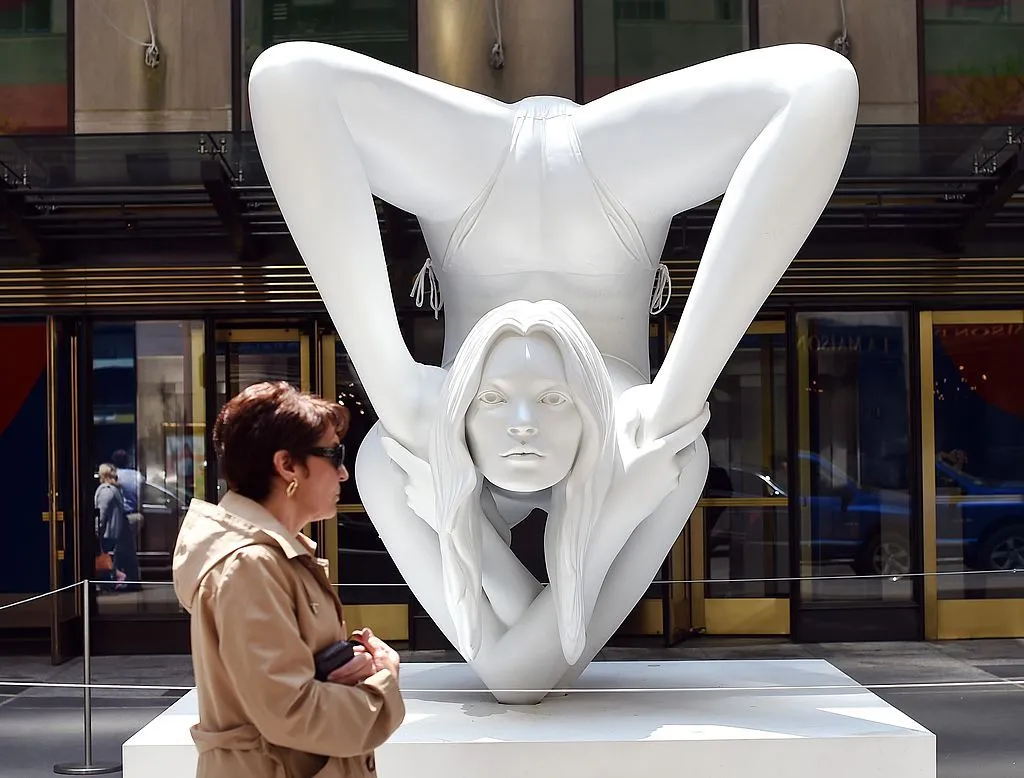 A woman passes by a sculpture by Marc Quinn titled "Myth Venus" before the start of the afternoon session auction May 14, 2014 at Christie's Morning & Afternoon Session of Post-War and Contemporary Art in New York.