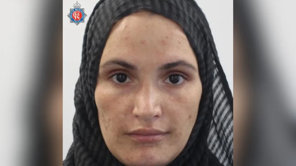 Woman's mugshot. A very close up picture of a woman's face.
