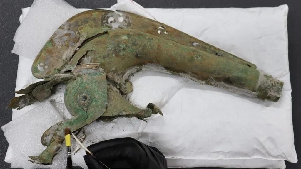Archaeologists uncover rare Iron Age war trumpet and boar standard