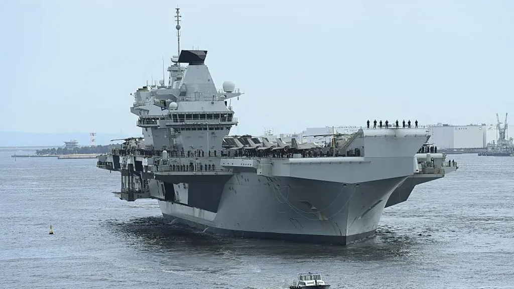 The Royal Navy aircraft carrier HMS Prince of Wales is pictured entering a port in Japan during August 2025.