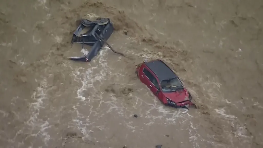 Aerial footage captures cars being swept away by flash floods on Great Ocean Road
