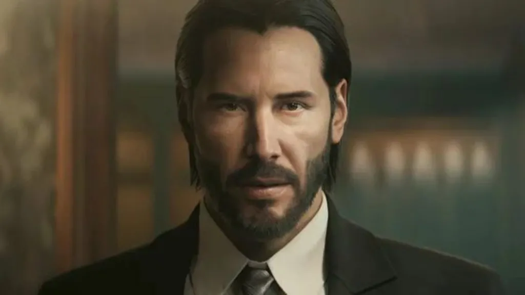 An in game screenshot of a video game version of Keanu Reeves as the character John Wick. He is wearing a suit and looking at the camera.
